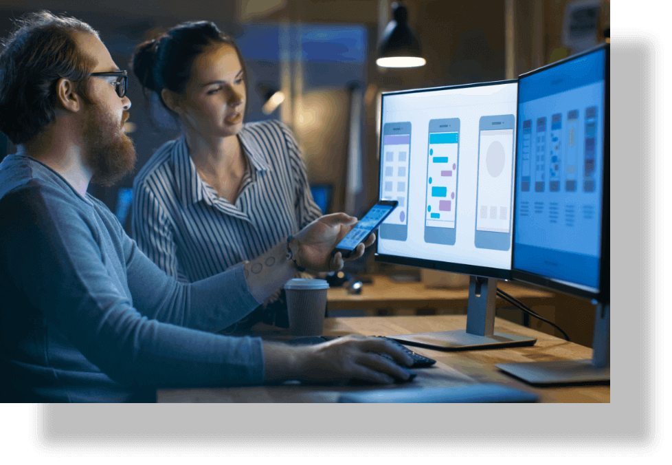 Two people looking at a computer screen.